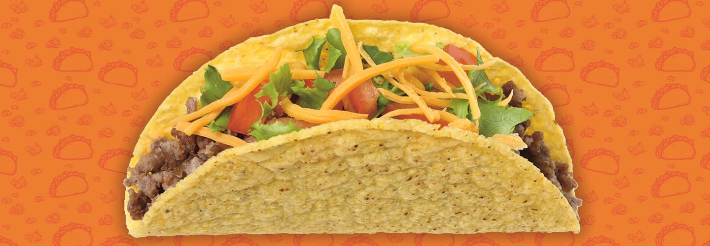 a taco in front of a textured orange background